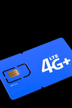 Size of sim card. Standard, micro and nano SIM card. SIM card for phone piled on a black background.