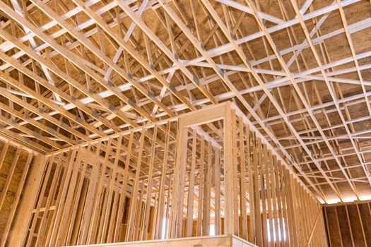 Wooden beams the roof of a private house without unfinishing inside a interior view