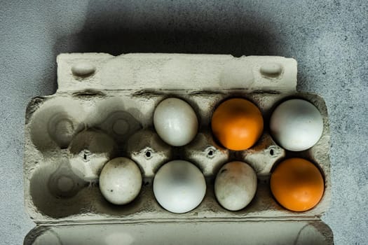 Cooking concept with vintage paper container full of eggs