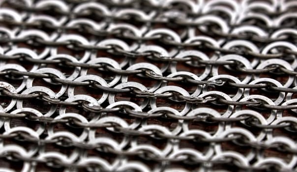 Chain-mail or Hauberk texture, metal protective armor of medieval or middle ages times. Hauberk medieval knight equipment shirt of ring mail