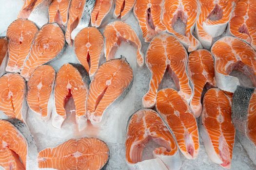 chunks of red fish in ice close-up. photo