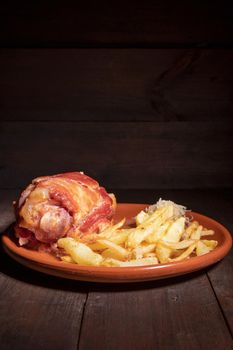 Pork Knuckle with Sauerkraut and fried Potatoes. High quality photography.