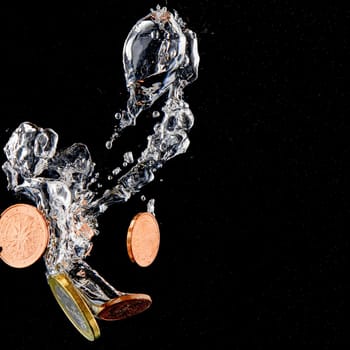 Sinking Euro. Splash of coins falling into the water. Coins in the water. Splash of coins falling into the water.