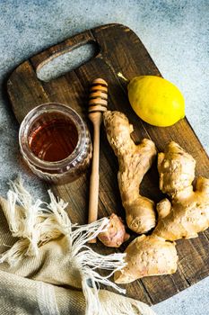 Ingredients for healthy tea with fresh lemon, ginger root and honey