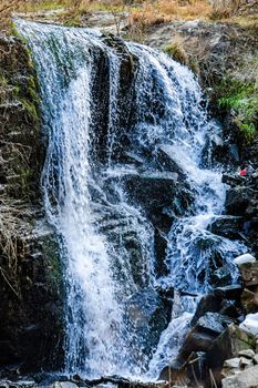 Waterfall in wild area close to georgian capital city Tbilisi in early sping season