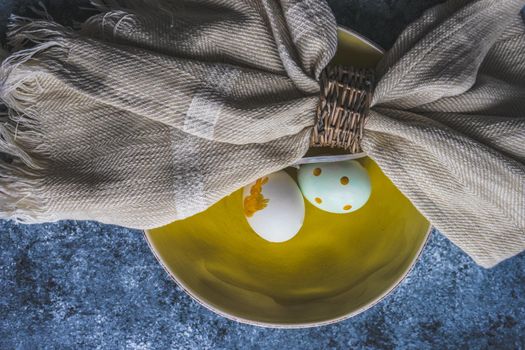 Easter minimalistic place setting on concrete background