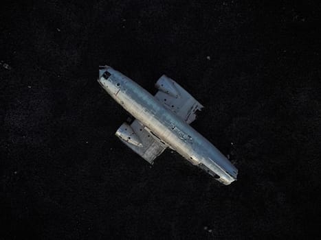 Abandoned DC-3 plane, wrecked airplane on a black sand beach. The most popular landmark in Iceland.