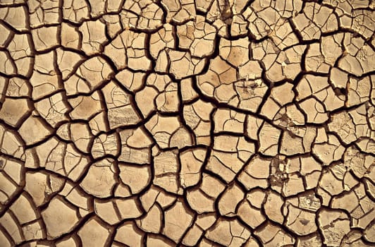 Desert. Aerial view of a beautiful cracks in the ground. texture, deep crack. Effects of heat and drought. effects of global warming. cracked desert landscape.