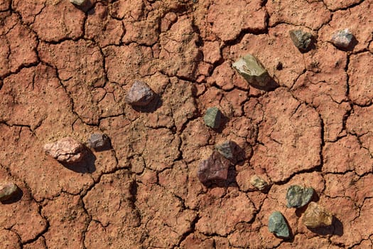 Black Gobi. Stony desert, black stones on the sand. Abstract natural background.