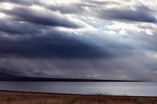 Panorama of a mountain lake. Somewhere in the vastness of Mongolia.