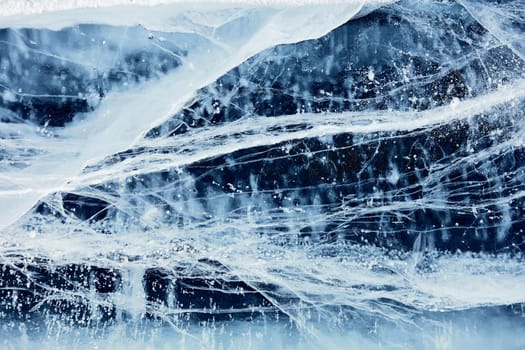 Texture of ice of Baikal lake in Siberia. blue lake ice.