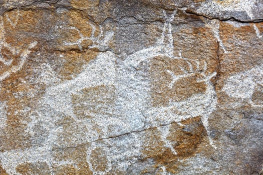 Rock paintings of ancient people. Image of ancient hunters with deer on the wall. ancient art, history, archeology