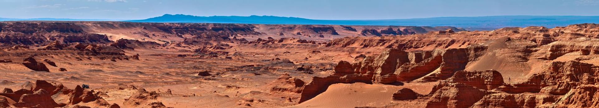 Herman Cav Canyon at sunset. South Gobi, Mongolia. Herman Tsav Canyon. Red Sandstone plateau, Martian landscape. The site of many paleontological finds. Cemetery of dinosaurs.