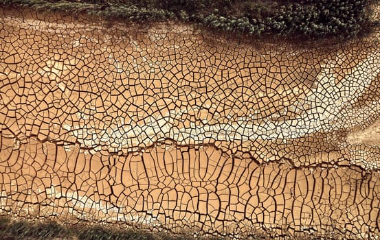 Desert. Aerial view of a beautiful cracks in the ground. texture, deep crack. Effects of heat and drought. effects of global warming. cracked desert landscape.