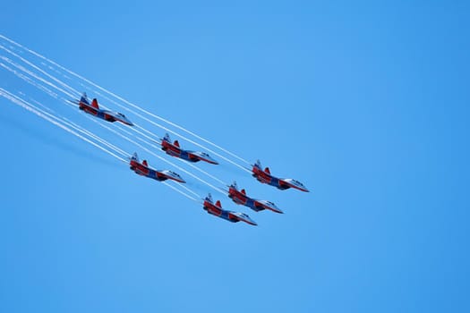 Airshow of the aerobatic team Strizhi (The Swifts). Aerobatic Team on fighters Mig-29, Russian Air Force, on at the International Aviation and Space salon MAKS 2019. ZHUKOVSKY, RUSSIA, 08,27,2019.