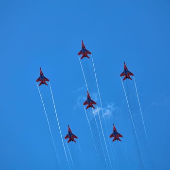 Airshow of the aerobatic team Strizhi (The Swifts). Aerobatic Team on fighters Mig-29, Russian Air Force, on at the International Aviation and Space salon MAKS 2019. ZHUKOVSKY, RUSSIA, 08,27,2019.