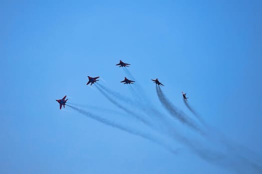 Airshow of the aerobatic team Strizhi (The Swifts). Aerobatic Team on fighters Mig-29, Russian Air Force, on at the International Aviation and Space salon MAKS 2019. ZHUKOVSKY, RUSSIA, 08,27,2019.