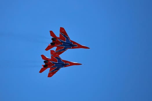 Airshow of the aerobatic team Strizhi (The Swifts). Aerobatic Team on fighters Mig-29, Russian Air Force, on at the International Aviation and Space salon MAKS 2019. ZHUKOVSKY, RUSSIA, 08,27,2019.