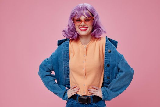 Pretty young female denim clothing fashion posing cap pink glasses color background unaltered. High quality photo