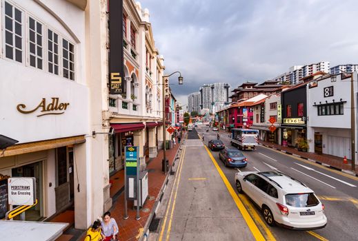 Malaysia, Singapore, 26 March 2018: Singapore's old town in cloudy weather, street with small houses, grocery stores and cafes. High quality photo