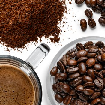 Coffee beans and ground coffee top view on a white background.