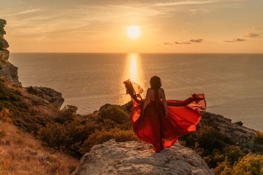Woman in red dress, fashion model in evening dress, soaring in the street, sunset.