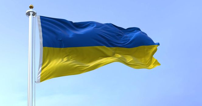 Detail of the national flag of Ukraine waving in the wind on a clear day. Democracy and politics. Eastern Europe country. Patriotism. Selective focus.