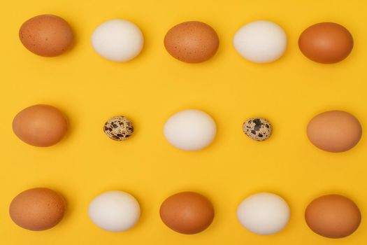 Easter eggs on a yellow background, place for an inscription in the center