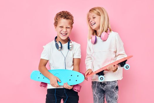 Active young people in headphones skateboards in hands lifestyle childhood. High quality photo