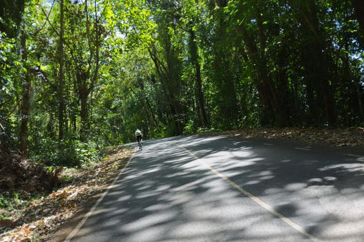 Man are cycling road bike in mountain road . KhaoYai, Korat, Thailand