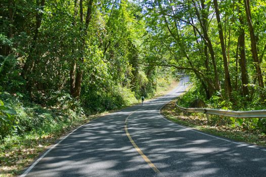 Man are cycling road bike in mountain road . KhaoYai, Korat, Thailand