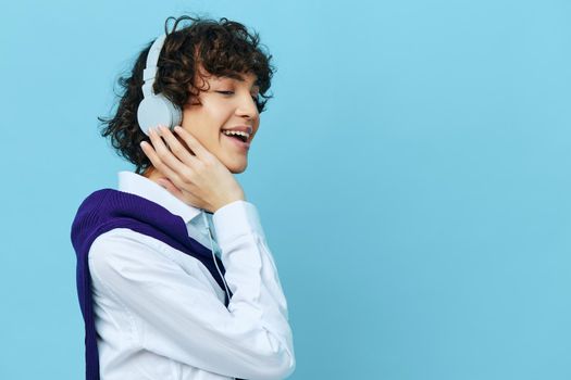 man technology headphones in a white shirt with sweater cropped view. High quality photo