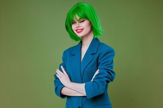 Beauty Fashion woman attractive look green wig blue jacket posing studio model unaltered. High quality photo