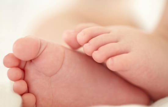 Cropped image of a babys feet.