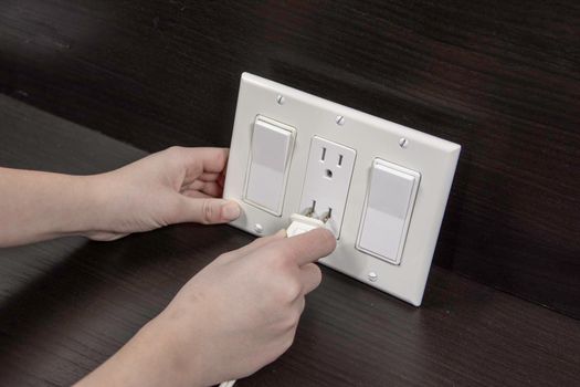 Checking electrical outlet connecting the electrical plug before installing it in a junction box on the wall