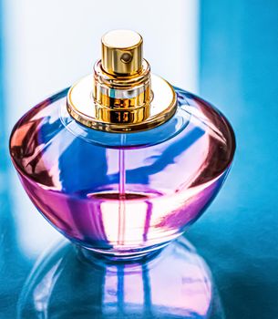 Perfume bottle on glossy background, sweet floral scent, glamour fragrance and eau de parfum as holiday gift and luxury beauty cosmetics brand design.