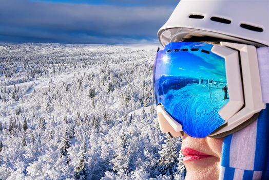 Portrait of woman in alps. woman in ski goggles at the ski resort. woman in mountain goggles. reflection in ski goggles