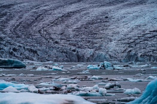 Spectacular glacier tongue end over icebergs lake in Iceland