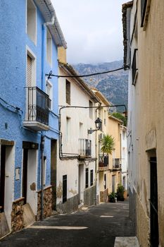 Bolulla, Alicante, Spain- February 4, 2022: Narrow Street and typical facades of Bolulla village in Alicante, Spain