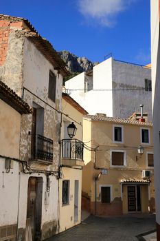 Bolulla, Alicante, Spain- February 4, 2022: Narrow Street and typical facades of Bolulla village in Alicante, Spain
