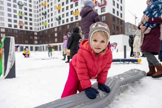 portrait of little girl playing snow on maslenitsa celebration winter russian holiday