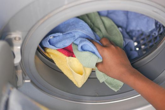 putting towel and cloths in a washing machine
