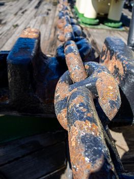 Large iron anchor chain. A rusty chain link. Corrosion.