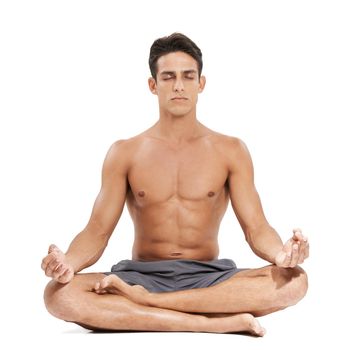 A handsome young man doing yoga on a white background.
