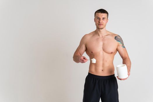 Fitness protein jars white on white background bodybuilder powder strong high body injury, ill stress, expression. Hold neck sickness, back suffer attractive