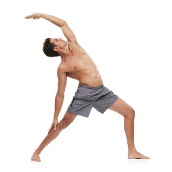 A handsome young man doing yoga on a white background.