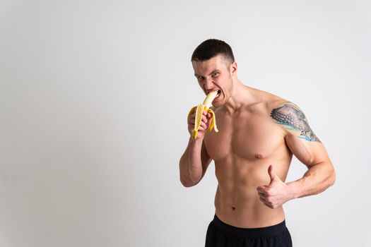 Man holds apples in fitness white background isolated fit health, handsome fruit model background, caucasian studio. strength red, bodybuilder chest