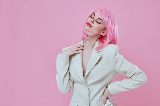 Beauty Fashion woman in a suit makeup pink hair posing color background unaltered. High quality photo