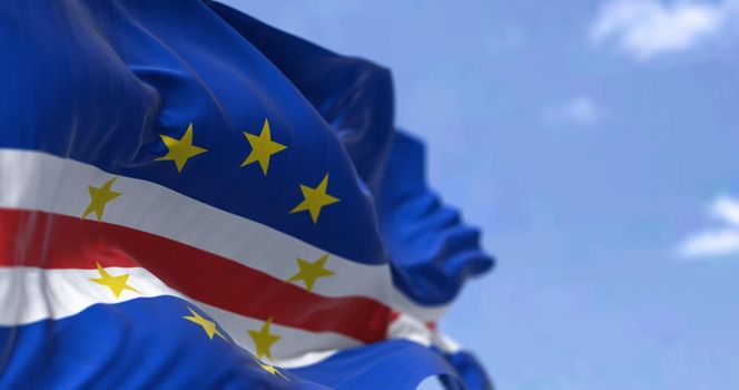 Detail of the national flag of Cape Verde waving in the wind on a clear day. Cape verde is an archipelago and island country in the central Atlantic Ocean. Patriotism. Selective focus.