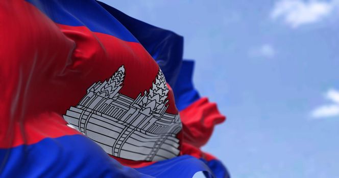 Detail of the national flag of Cambodia waving in the wind on a clear day. Cambodia is a country located in the southern portion of the Indochinese Peninsula in Southeast Asia. Selective focus.